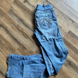 R.E.A.L. Mid Rise Stretch Whipstitch Boot Cut Jean